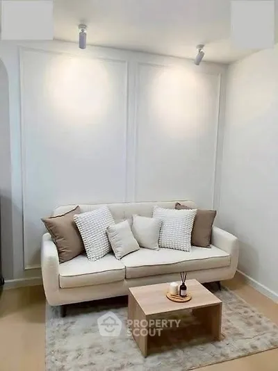 Cozy living room with modern white sofa and stylish decor