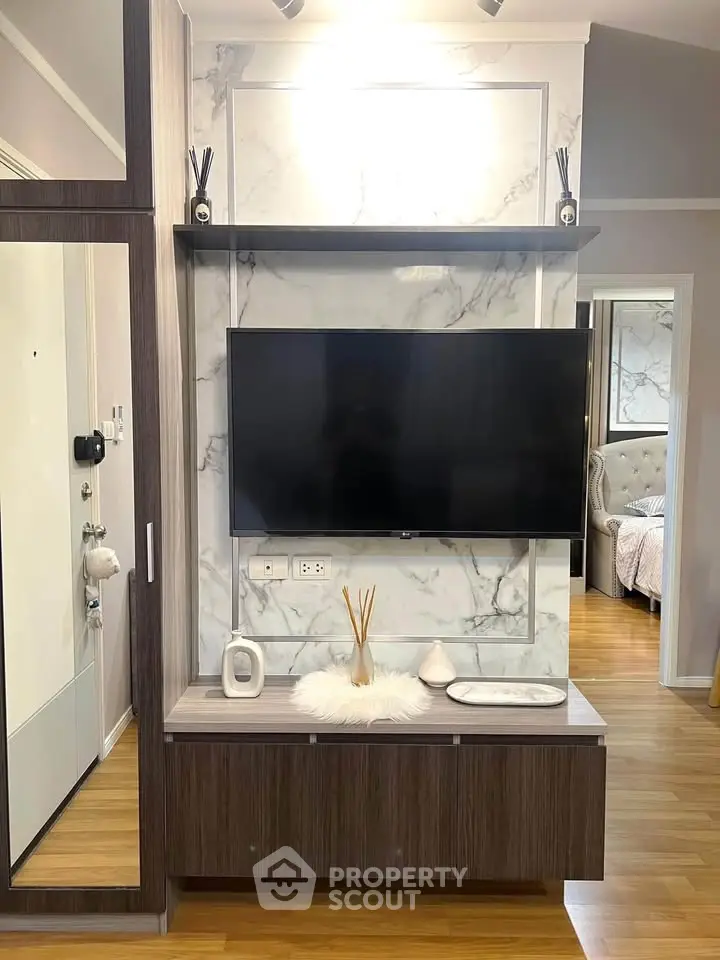 Modern living room with wall-mounted TV and stylish decor