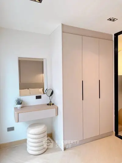 Stylish bedroom corner with modern wardrobe and vanity setup