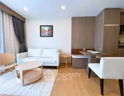 Modern living room with stylish furniture and natural light, perfect for relaxation and entertaining.