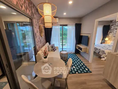 Modern open-plan living room with stylish decor and natural light