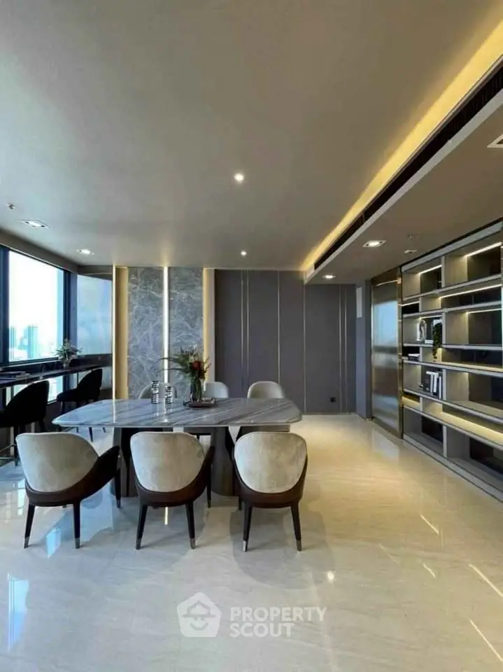 Luxurious modern dining area with panoramic city views and elegant furnishings.