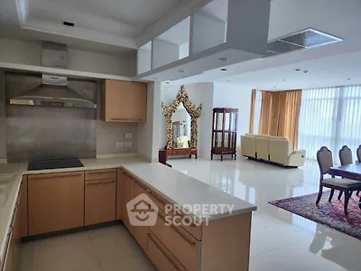 Spacious open-plan kitchen and living area with modern design and elegant furnishings.