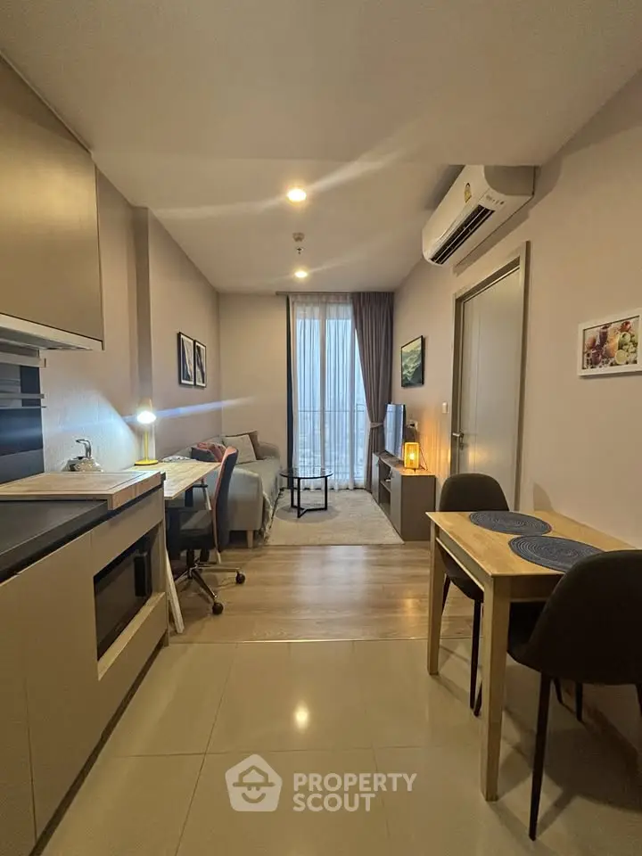 Modern apartment interior with cozy living room and dining area, featuring stylish furniture and ambient lighting.
