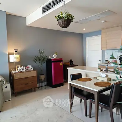 Modern open-layout living room with dining area and stylish decor