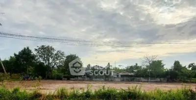 Spacious land plot with lush greenery and serene surroundings, perfect for development opportunities.