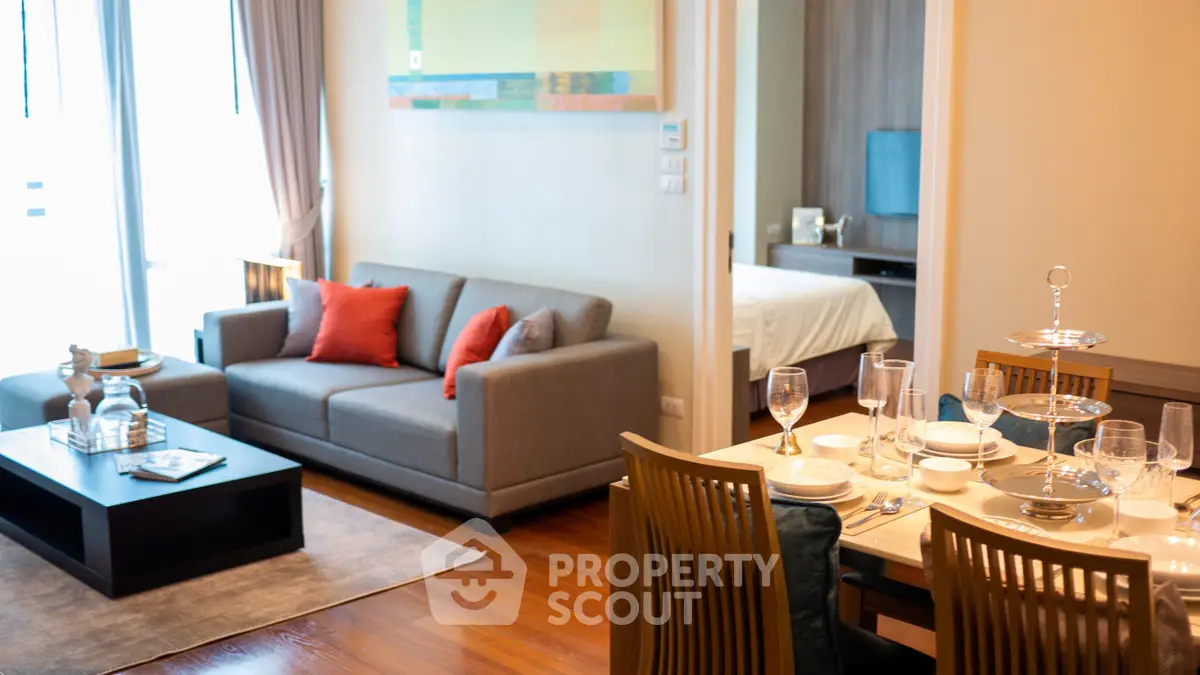 Stylish open-plan living and dining area with modern decor and cozy ambiance