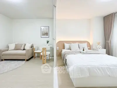 Modern studio apartment with cozy living area and stylish bedroom