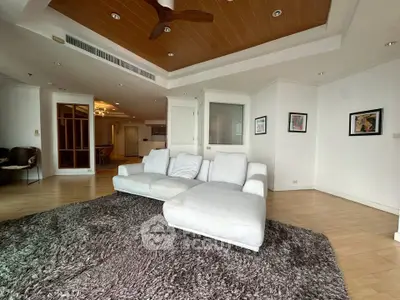 Spacious living room with modern decor and cozy seating area
