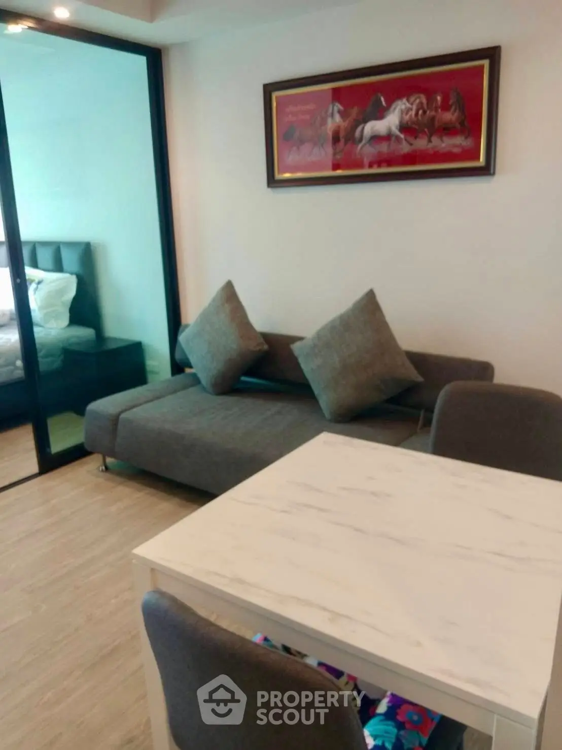 Modern living room with stylish decor and cozy seating area in a contemporary apartment.