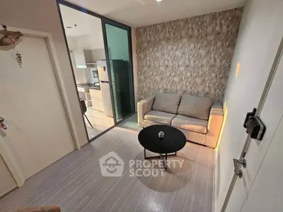 Modern living room with cozy sofa and stylish kitchen view
