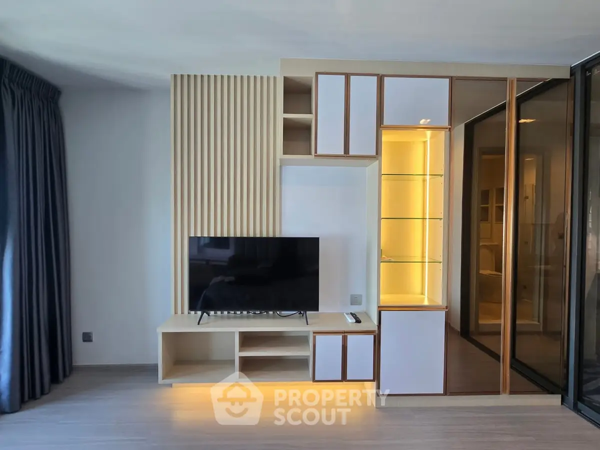 Modern living room with sleek TV unit and ambient lighting