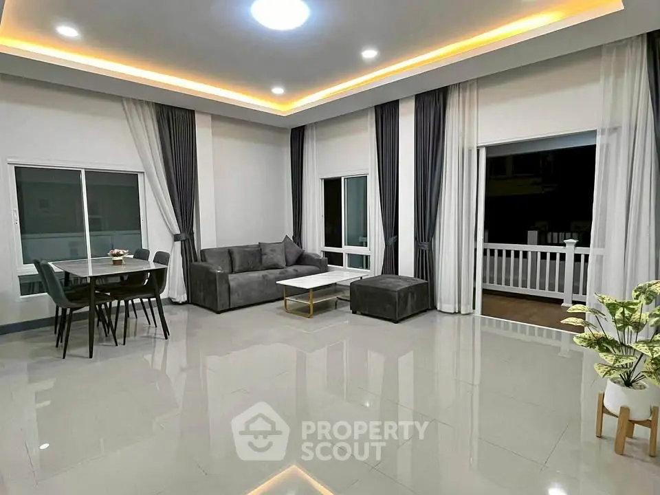 Spacious modern living room with elegant decor and large windows