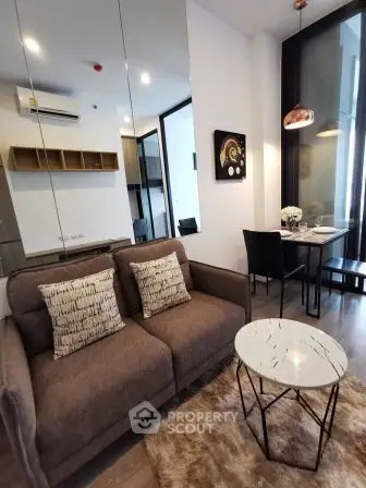 Modern living room with stylish decor and cozy seating area in a contemporary apartment.
