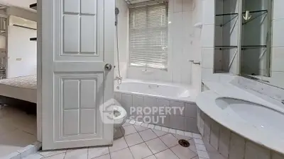 Spacious bathroom with bathtub and modern fixtures in a stylish home