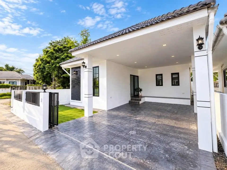 Modern single-story home with spacious driveway and elegant exterior design.