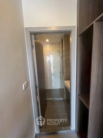 Compact bathroom with modern fixtures and sleek design in a contemporary apartment.