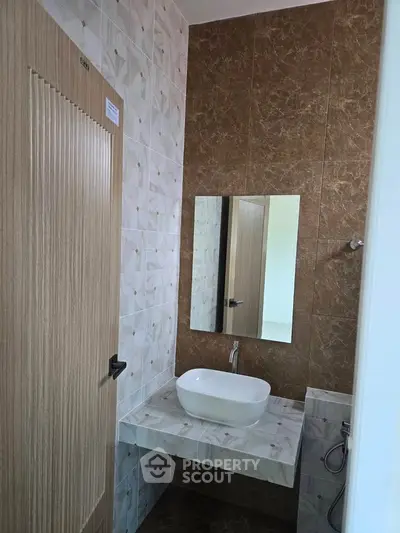 Modern bathroom with stylish sink and elegant tile design