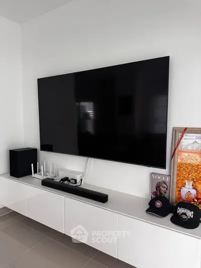 Modern living room with sleek wall-mounted TV and stylish decor