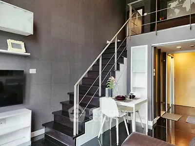 Modern duplex apartment with sleek staircase and stylish decor