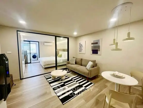 Modern open-plan living room with stylish decor and cozy ambiance