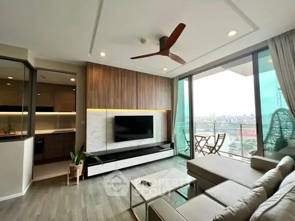 Modern living room with large windows and city view, featuring stylish decor and open layout.