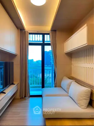 Modern living room with cozy sofa and large window offering city view