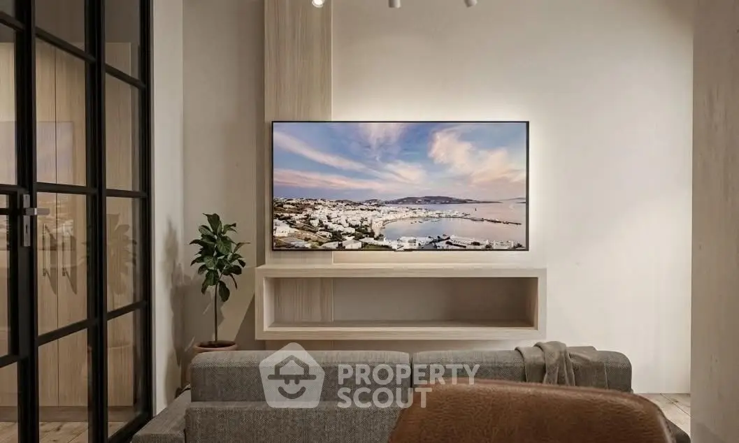 Modern living room with large TV and stylish decor