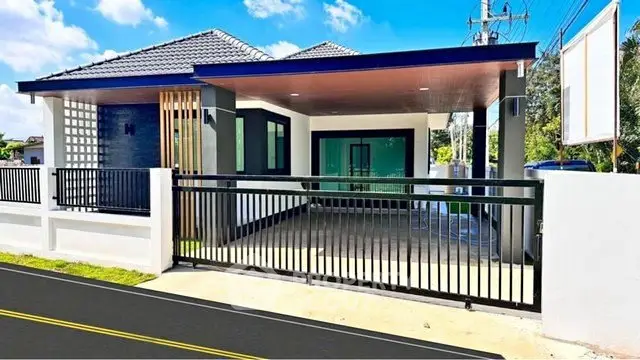 Modern single-story home with sleek design and spacious driveway