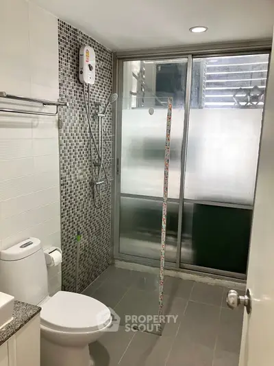 Modern bathroom with sleek shower and stylish tile design