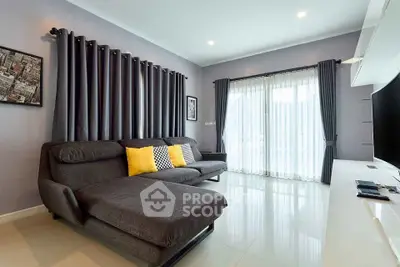 Modern living room with sleek gray sofa and stylish decor