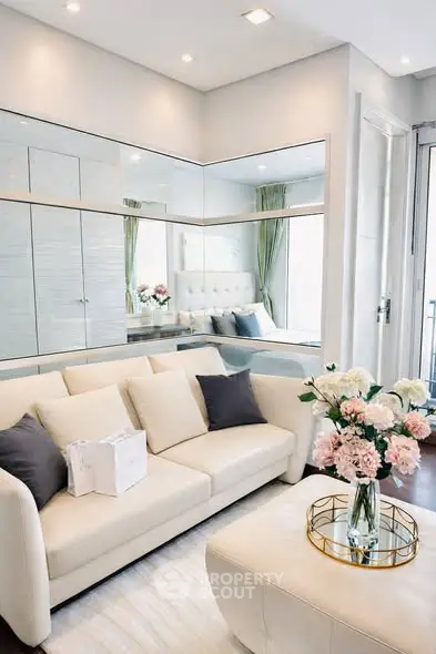 Elegant living room with modern decor and floral accents