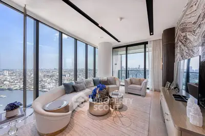 Luxurious high-rise living room with panoramic city views and elegant modern decor.