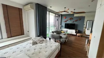 Spacious modern living room with large windows and stylish decor