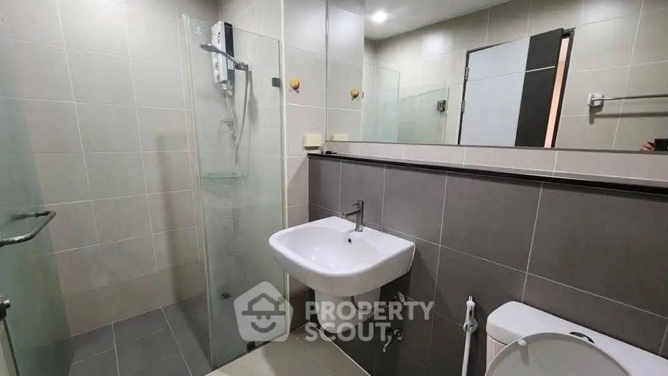Modern bathroom with sleek design and glass shower enclosure