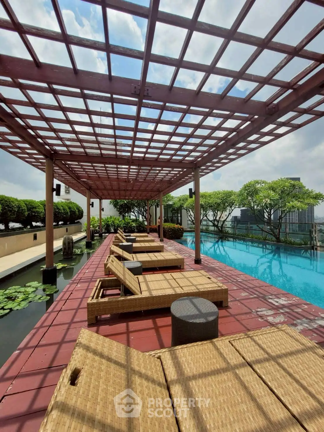 Luxurious rooftop pool with stylish loungers and stunning city views.