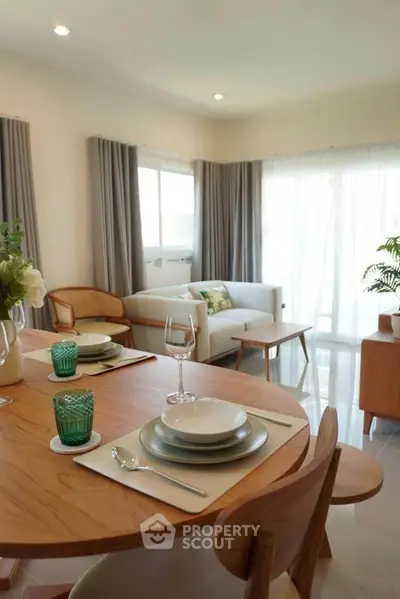 Stylish living room with elegant dining setup and natural light