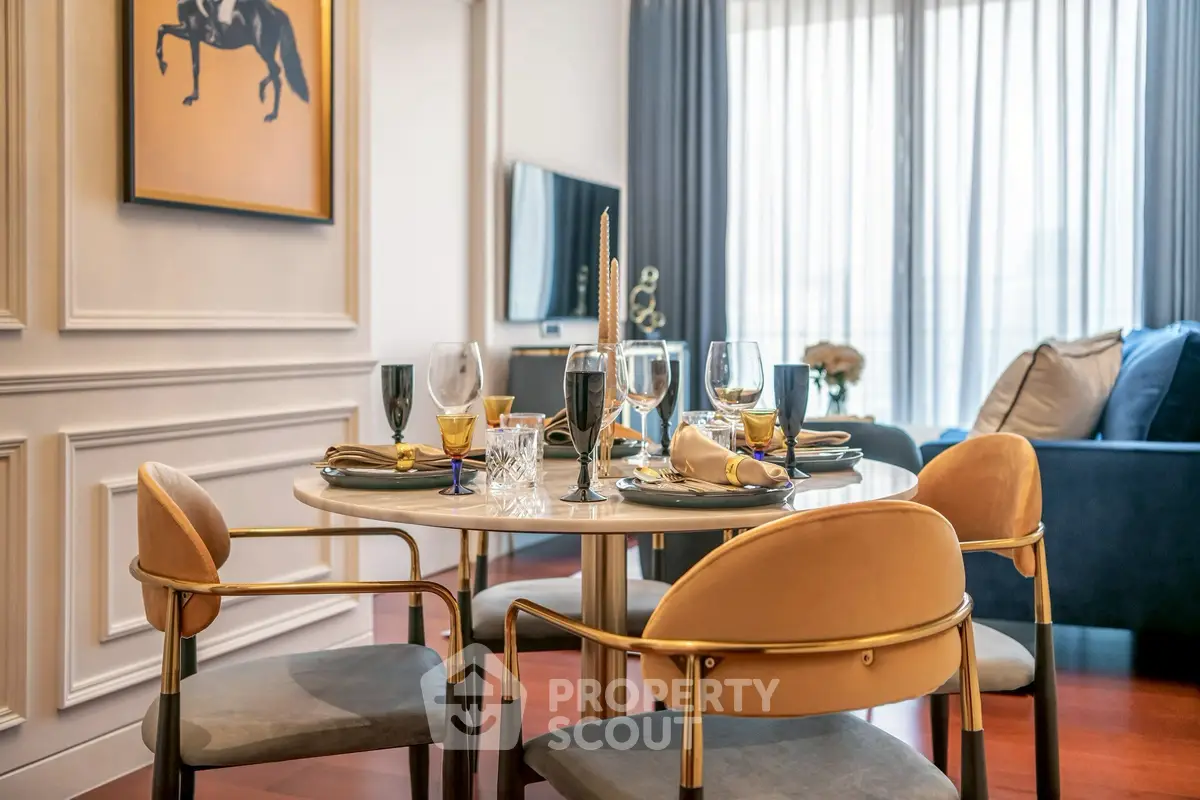Elegant dining area with stylish chairs and table setting in a modern living room.
