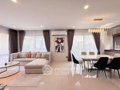 Spacious modern living room with elegant dining area and stylish decor