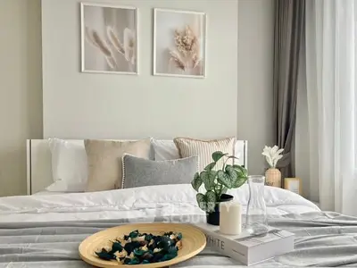 Elegant bedroom with stylish decor and cozy bedding