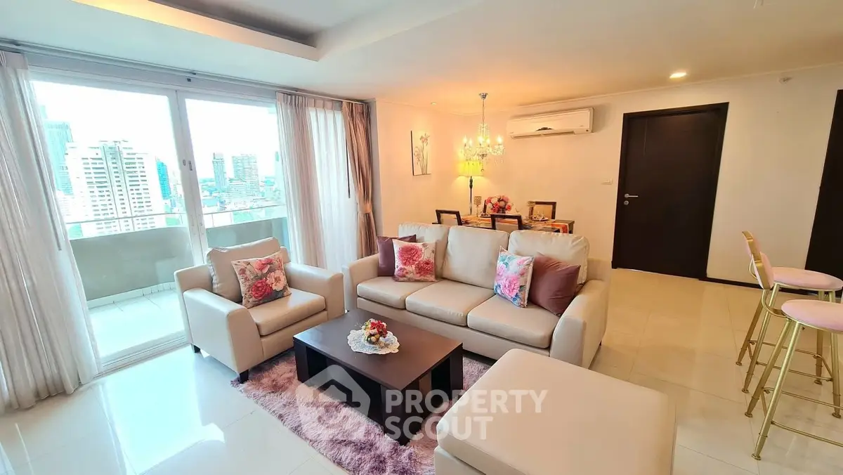 Spacious living room with elegant decor and city view balcony in modern apartment.