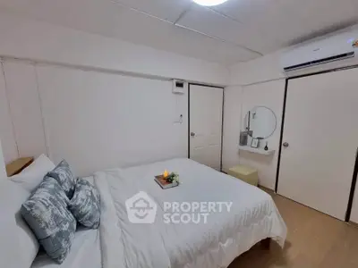 Cozy bedroom with modern decor and air conditioning