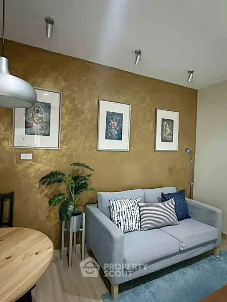 Stylish living room with gold accent wall and modern decor