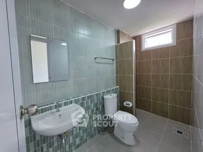 Modern bathroom with sleek tiles and contemporary fixtures