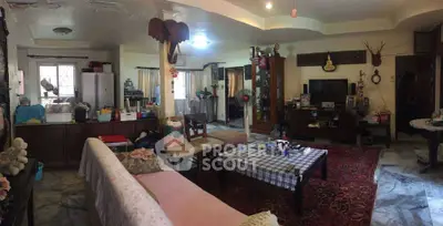 Spacious living room with eclectic decor and cozy seating area