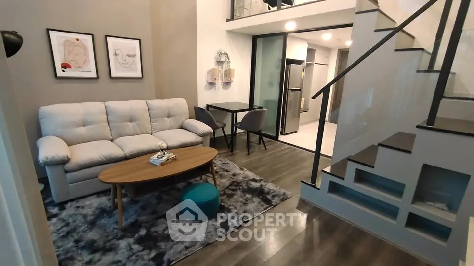 Modern duplex living room with stylish decor and open staircase
