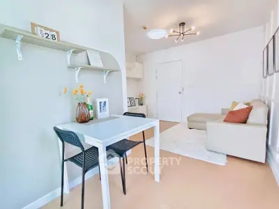 Bright and modern living room with stylish decor and cozy seating area.
