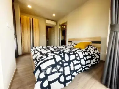 Modern bedroom with stylish decor and wooden flooring