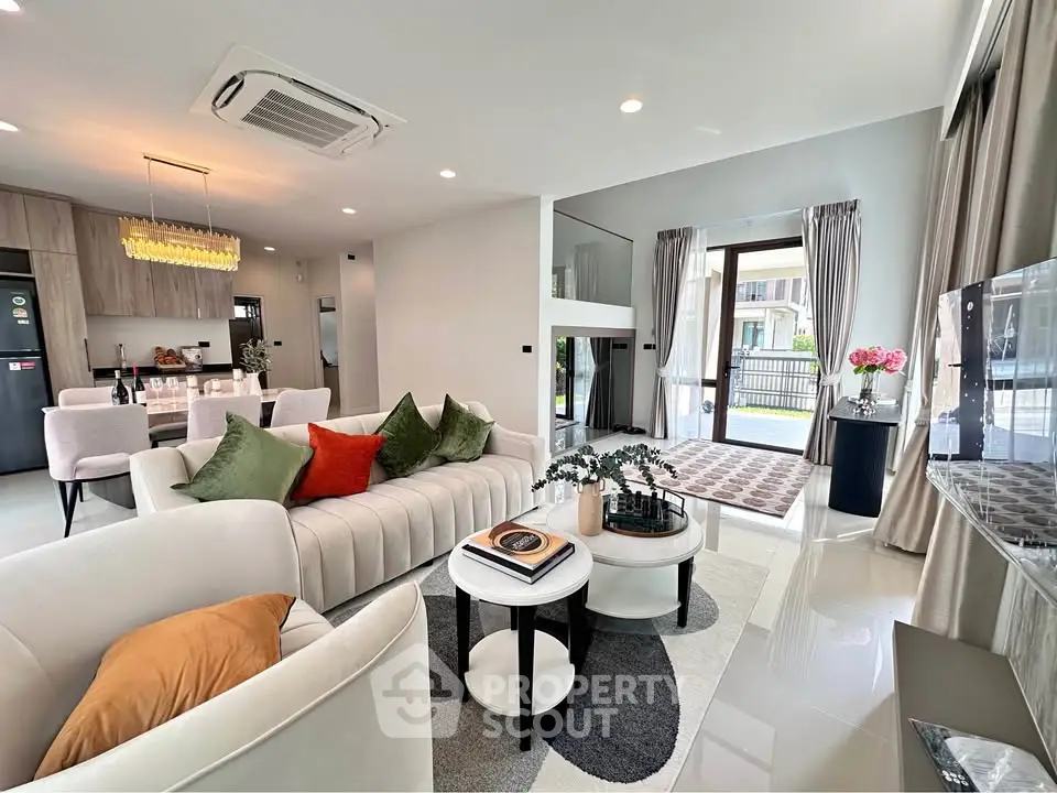 Luxurious modern living room with elegant decor and open kitchen layout