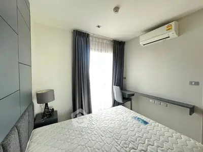 Modern bedroom with natural light and air conditioning